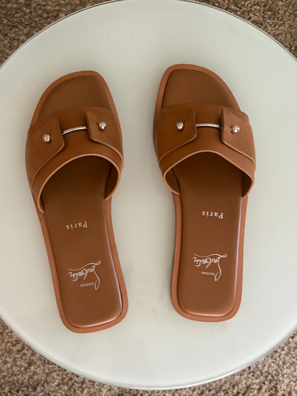 Christian Louboutin tan slides with red bottoms